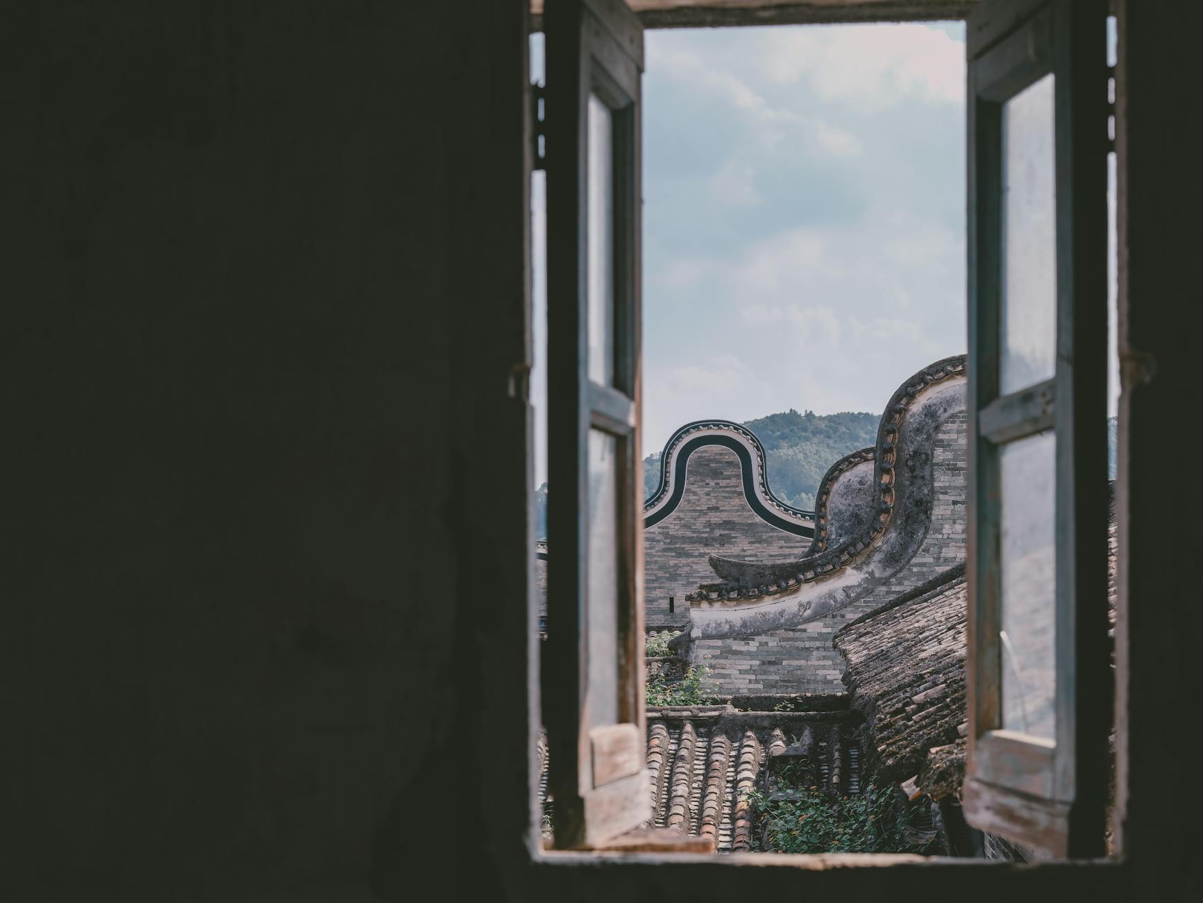 view of historic buildings in shangyue village through an open window