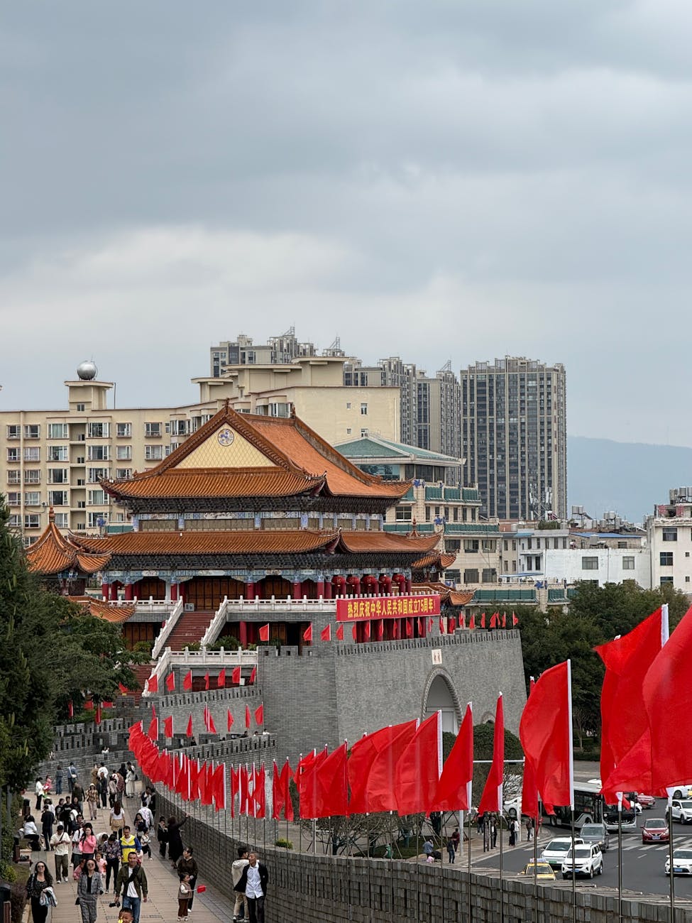 red flags adorning ancient building in urban setting